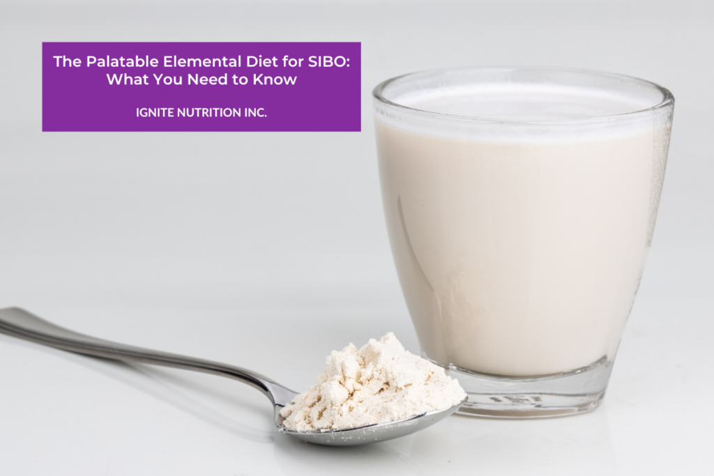 A spoon filled with a white powder is sitting next to a glass that is filled with a mixed nutritional drink